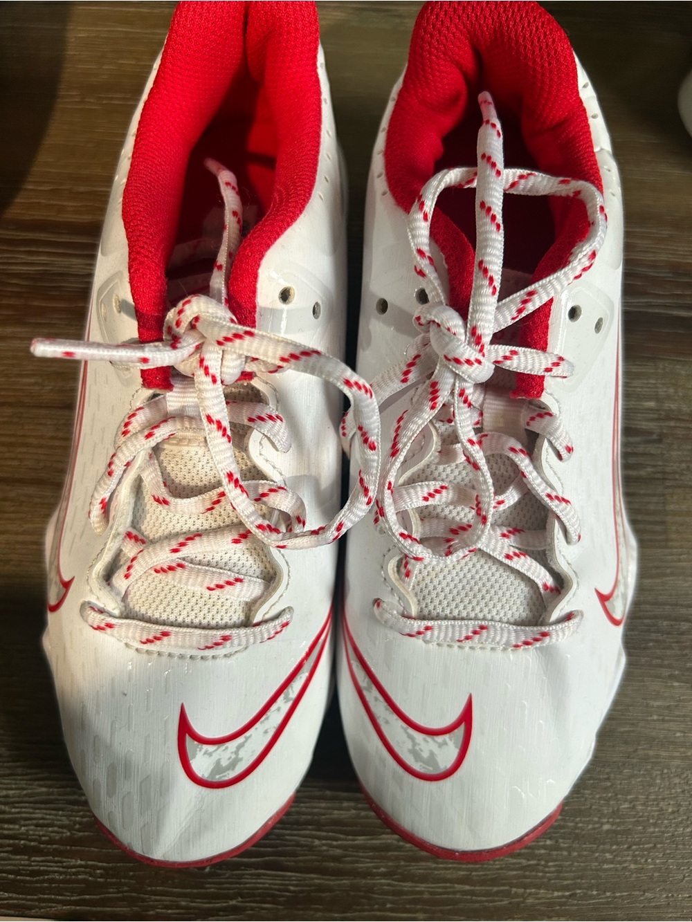 Nike Kids White cleats  with Red and Camo Accents